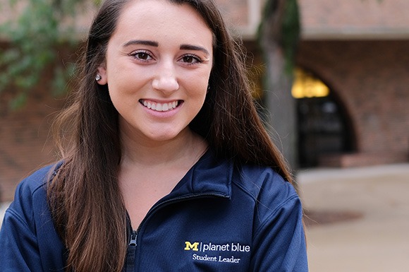 Planet Blue student leader smiling at camera